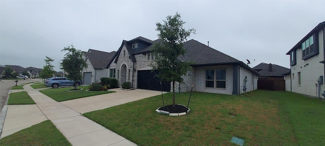 1094 Canterbury Ln, Forney, TX 75126 - french country home with concrete driveway, a front lawn, stone siding, a residential view, and a garage