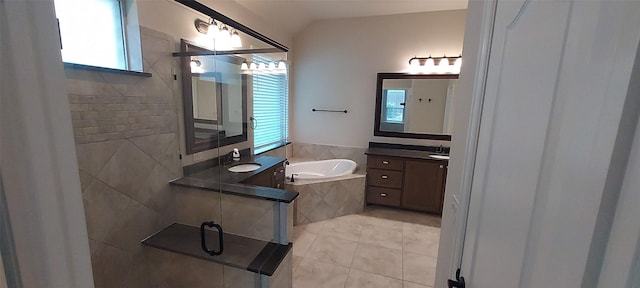 1094 Canterbury Ln, Forney, TX 75126 - bathroom with vanity, a bath, lofted ceiling, a stall shower, and tile patterned floors