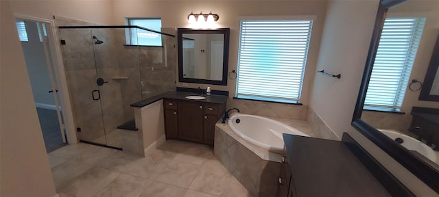 1094 Canterbury Ln, Forney, TX 75126 - full bathroom featuring vanity, a shower stall, a bath, and healthy amount of natural light