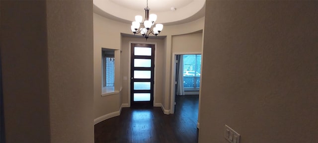 1094 Canterbury Ln, Forney, TX 75126 - entryway featuring a chandelier, dark wood-type flooring, and baseboards