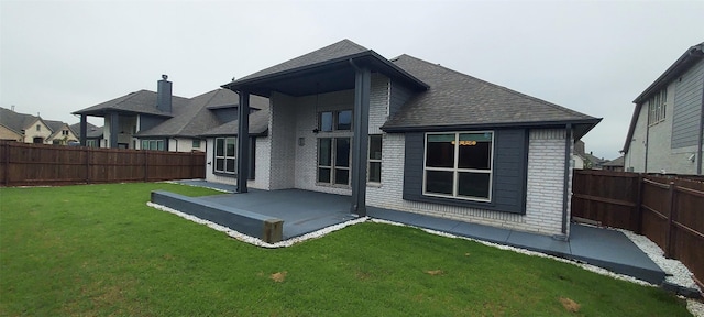 1094 Canterbury Ln, Forney, TX 75126 - back of property with a patio, brick siding, and a shingled roof