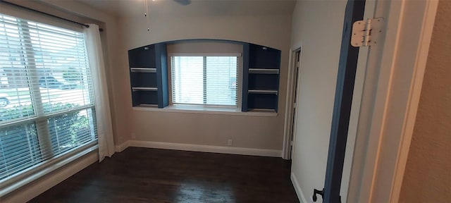 1094 Canterbury Ln, Forney, TX 75126 - unfurnished room with healthy amount of natural light, baseboards, and dark wood-style floors