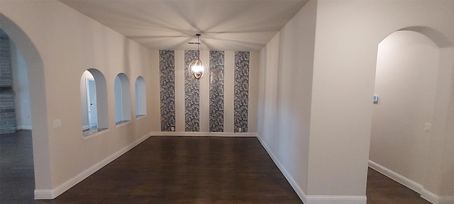 1094 Canterbury Ln, Forney, TX 75126 - corridor featuring arched walkways, dark wood finished floors, and baseboards