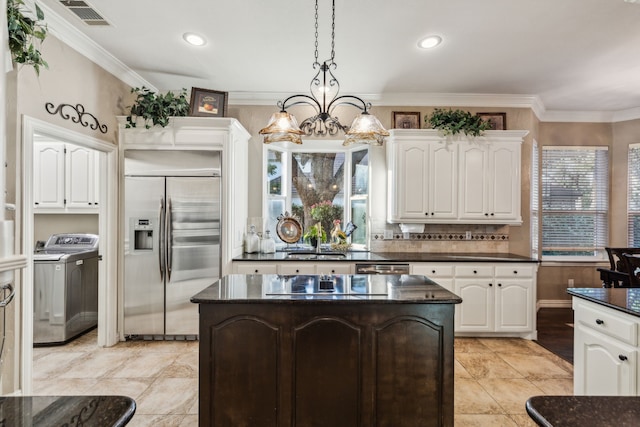 5005 Summerbrook Dr, Colleyville, TX 76034 - kitchen with appliances with stainless steel finishes, a center island, white cabinetry, tasteful backsplash, and crown molding