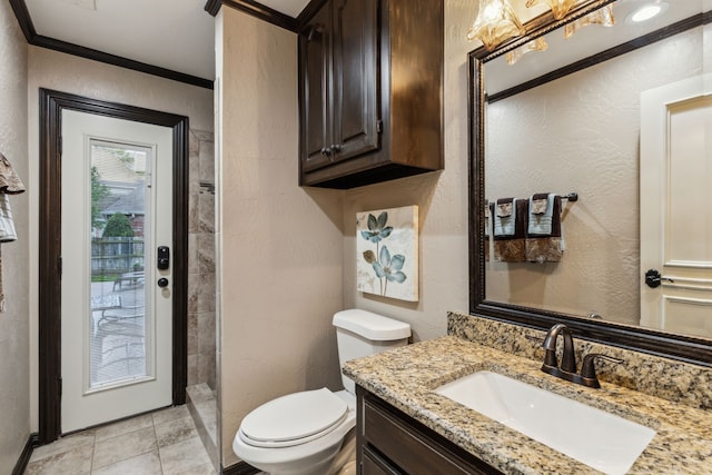 5005 Summerbrook Dr, Colleyville, TX 76034 - bathroom featuring toilet, vanity, a tile shower, crown molding, and a textured wall