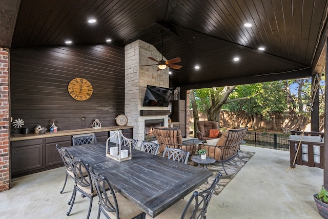5005 Summerbrook Dr, Colleyville, TX 76034 - view of patio with an outdoor stone fireplace, a ceiling fan, and outdoor dining space