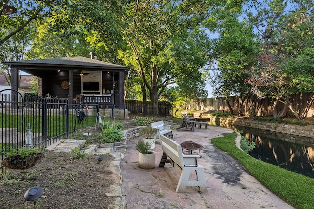 5005 Summerbrook Dr, Colleyville, TX 76034 - fenced yard featuring a fire pit, a patio area, and a ceiling fan
