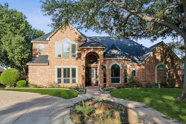 5005 Summerbrook Dr, Colleyville, TX 76034 - view of front of home with brick siding and a front yard