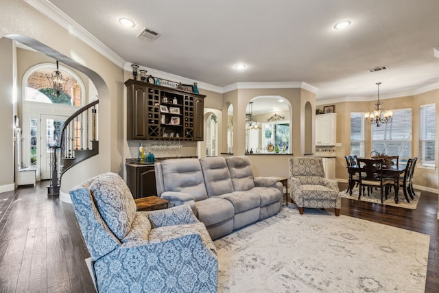 5005 Summerbrook Dr, Colleyville, TX 76034 - living room with a chandelier, dark wood-type flooring, arched walkways, a bar, and recessed lighting