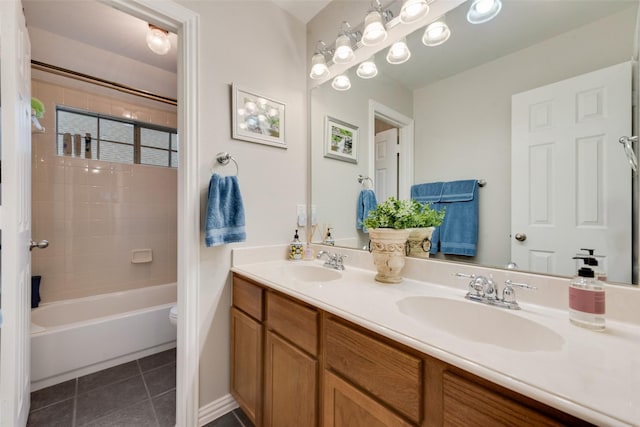 6702 Amesbury Ln, Rowlett, TX 75089 - full bath featuring double vanity, toilet, tile patterned floors, and shower / washtub combination