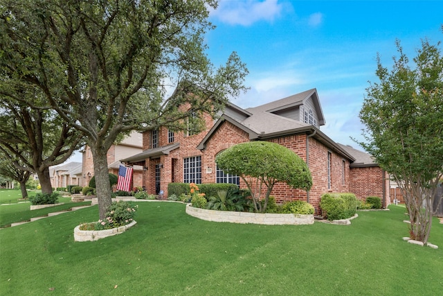 6702 Amesbury Ln, Rowlett, TX 75089 - traditional-style house with brick siding and a shingled roof