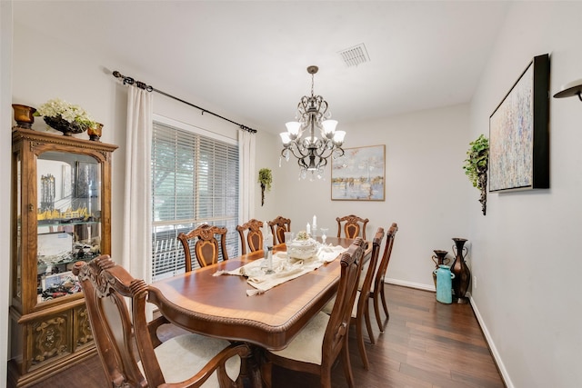 6702 Amesbury Ln, Rowlett, TX 75089 - dining room featuring a chandelier, baseboards, and dark wood-style floors