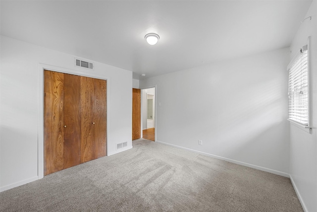 2607 Glendale Dr, Waco, TX 76710 - unfurnished bedroom featuring carpet, a closet, and baseboards