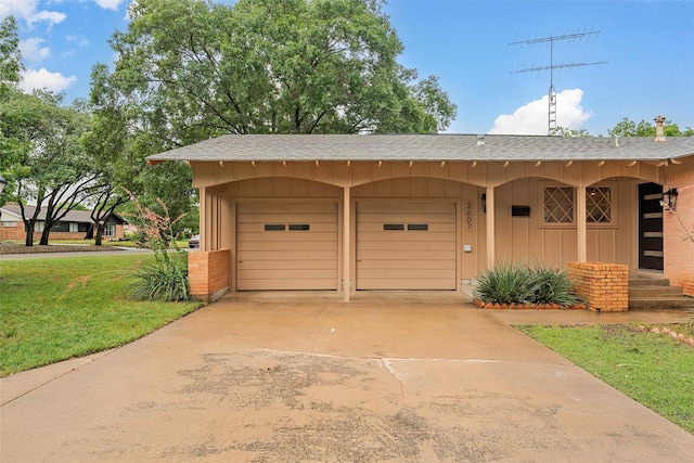 2607 Glendale Dr, Waco, TX 76710 - view of front of house featuring board and batten siding, a shingled roof, a front lawn, and concrete driveway