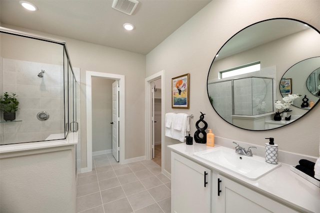 222 Goosewood Dr, Mckinney, TX 75071 - full bathroom with a shower stall, a spacious closet, vanity, tile patterned floors, and recessed lighting