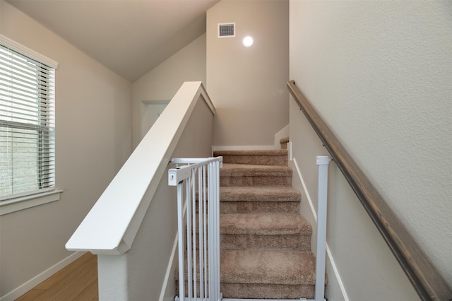 222 Goosewood Dr, Mckinney, TX 75071 - stairs with wood finished floors, vaulted ceiling, and baseboards