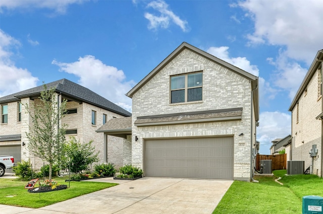 222 Goosewood Dr, Mckinney, TX 75071 - traditional home featuring cooling unit, brick siding, a garage, and driveway
