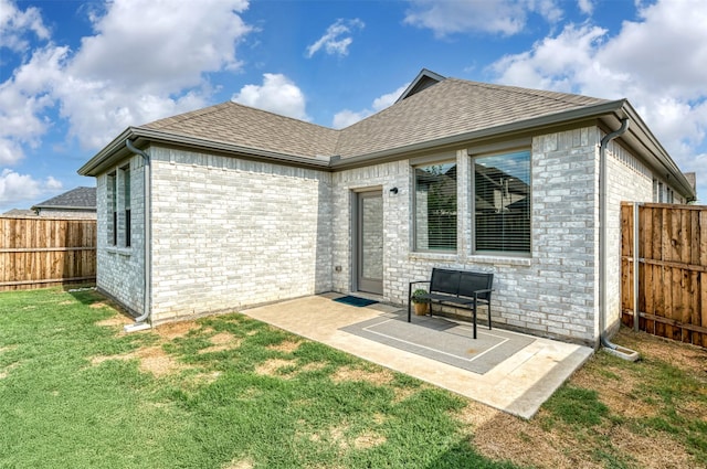 222 Goosewood Dr, Mckinney, TX 75071 - back of house featuring a patio area, roof with shingles, and brick siding