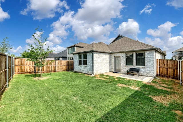 222 Goosewood Dr, Mckinney, TX 75071 - back of house with a shingled roof, a patio area, and brick siding