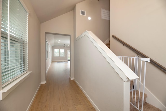 222 Goosewood Dr, Mckinney, TX 75071 - hallway featuring an upstairs landing, hardwood / wood-style floors, baseboards, and high vaulted ceiling