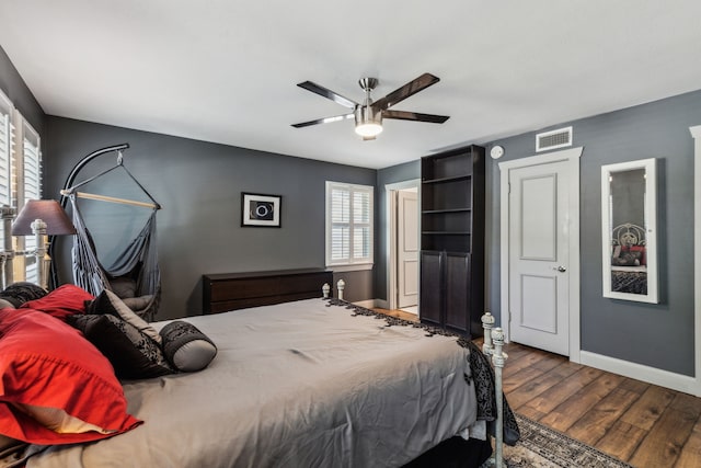 12217 Veronica Rd, Farmers Branch, TX 75234 - bedroom featuring wood finished floors, baseboards, and a ceiling fan