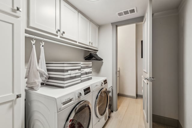 12217 Veronica Rd, Farmers Branch, TX 75234 - washroom featuring washing machine and clothes dryer, cabinet space, and baseboards