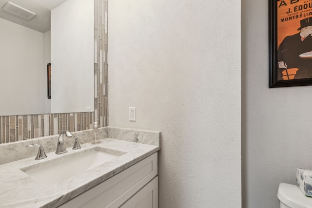 12217 Veronica Rd, Farmers Branch, TX 75234 - bathroom featuring toilet and vanity