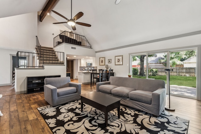 12217 Veronica Rd, Farmers Branch, TX 75234 - living room featuring hardwood / wood-style floors, high vaulted ceiling, stairway, beam ceiling, and a ceiling fan