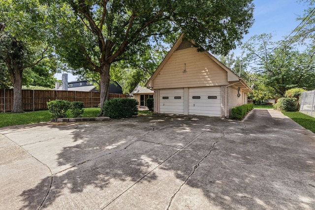 12217 Veronica Rd, Farmers Branch, TX 75234 - view of property exterior featuring brick siding, a garage, and an outdoor structure