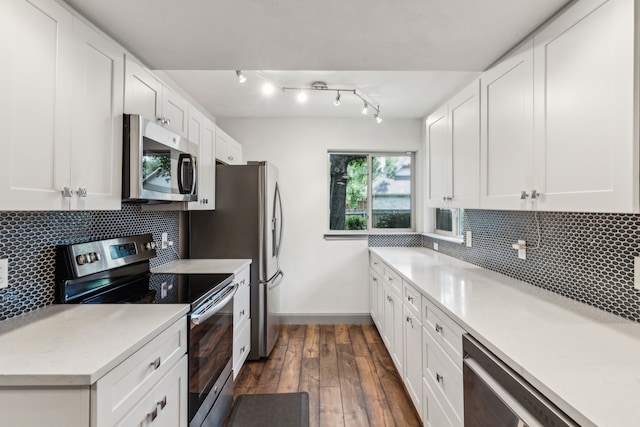 12217 Veronica Rd, Farmers Branch, TX 75234 - kitchen featuring stainless steel appliances, dark wood-style flooring, white cabinetry, and light countertops