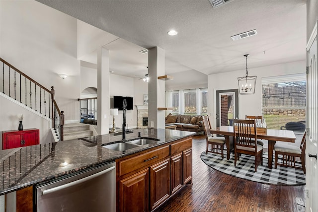 952 Tara Dr, Burleson, TX 76028 - kitchen with dishwasher, a sink, open floor plan, ceiling fan, and dark wood-style floors