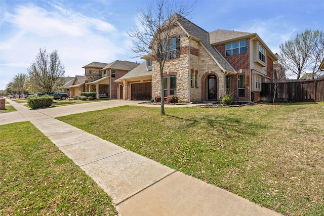 952 Tara Dr, Burleson, TX 76028 - view of front of property with concrete driveway, a garage, stone siding, and brick siding