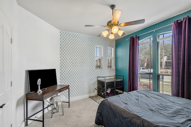 952 Tara Dr, Burleson, TX 76028 - carpeted bedroom featuring an accent wall, baseboards, and a ceiling fan
