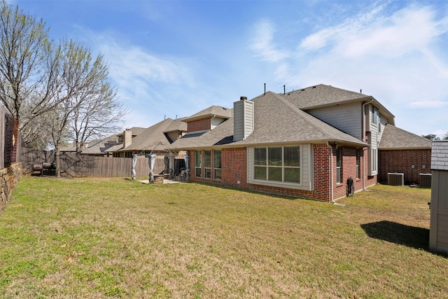 952 Tara Dr, Burleson, TX 76028 - back of property featuring cooling unit, brick siding, a shingled roof, and a chimney