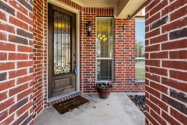 952 Tara Dr, Burleson, TX 76028 - view of exterior entry featuring brick siding and covered porch