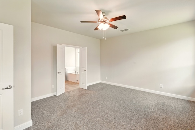 524 Big Horn Pass, Denton, TX 76210 - spare room with light colored carpet, ceiling fan, and baseboards
