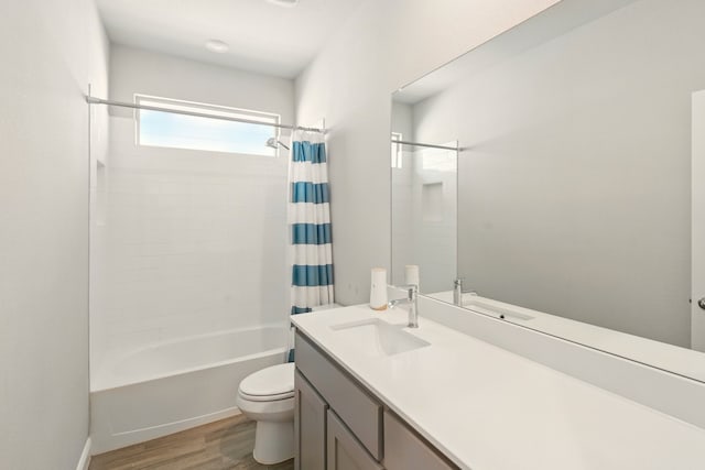 524 Big Horn Pass, Denton, TX 76210 - full bathroom featuring toilet, vanity, wood finished floors, and shower / tub combo