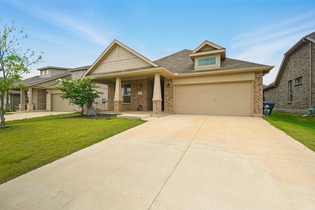 524 Big Horn Pass, Denton, TX 76210 - craftsman-style home featuring brick siding, an attached garage, a front lawn, and concrete driveway