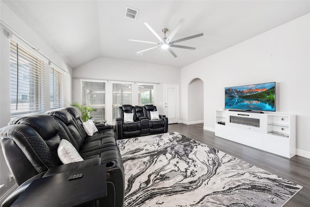 558 Lily St, Crowley, TX 76036 - living area with a ceiling fan, arched walkways, vaulted ceiling, dark wood-style flooring, and baseboards