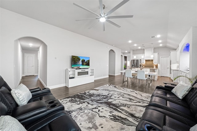 558 Lily St, Crowley, TX 76036 - living room featuring arched walkways, a ceiling fan, lofted ceiling, recessed lighting, and dark wood finished floors