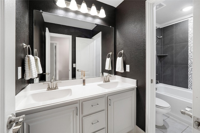 558 Lily St, Crowley, TX 76036 - bathroom featuring toilet, double vanity, a textured wall, shower / tub combination, and tile patterned floors
