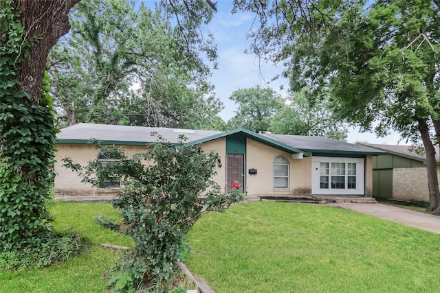 214 Independence Dr, Garland, TX 75043 - view of front of property with a front lawn and stucco siding