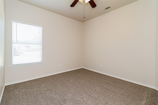 1012 Fairweather Dr, Fort Worth, TX 76120 - unfurnished room featuring dark colored carpet, ceiling fan, and baseboards