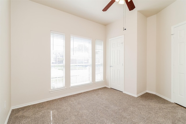 1012 Fairweather Dr, Fort Worth, TX 76120 - unfurnished bedroom with carpet, baseboards, and a ceiling fan