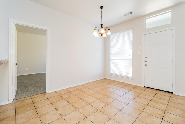 1012 Fairweather Dr, Fort Worth, TX 76120 - entryway featuring a chandelier and baseboards