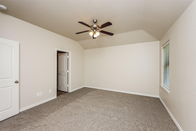 7660 Hollow Forest Dr, Fort Worth, TX 76123 - unfurnished bedroom featuring vaulted ceiling, carpet flooring, baseboards, a ceiling fan, and a textured ceiling