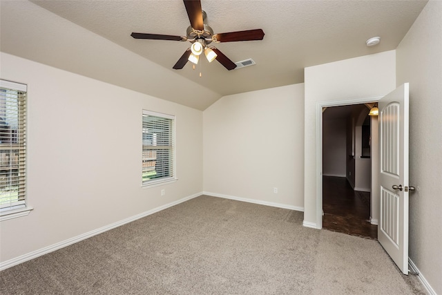7660 Hollow Forest Dr, Fort Worth, TX 76123 - unfurnished bedroom with light carpet, vaulted ceiling, ceiling fan, and baseboards