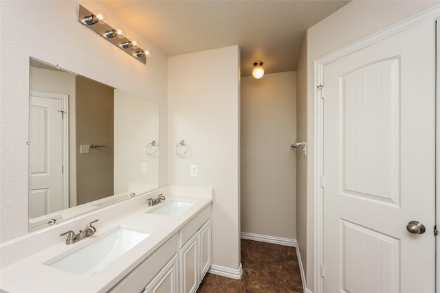 7660 Hollow Forest Dr, Fort Worth, TX 76123 - bathroom with double vanity and baseboards
