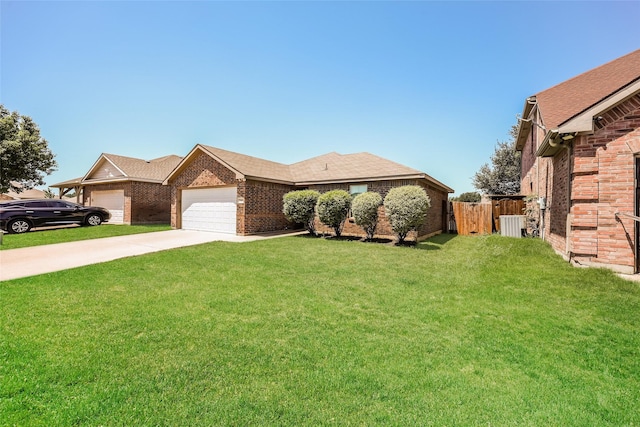 7660 Hollow Forest Dr, Fort Worth, TX 76123 - view of front facade with brick siding, a garage, driveway, and roof with shingles