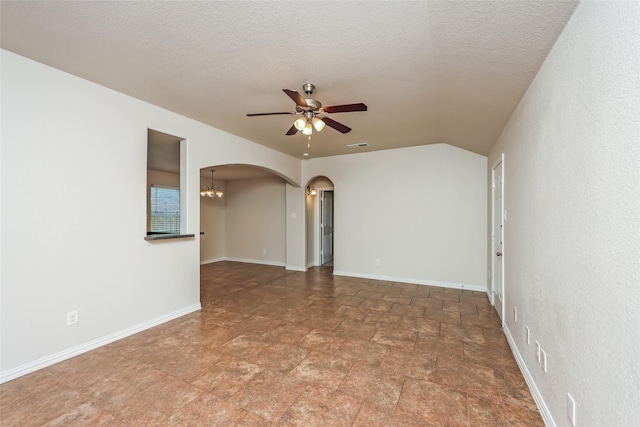 7660 Hollow Forest Dr, Fort Worth, TX 76123 - empty room with ceiling fan, arched walkways, a chandelier, stone finish floors, and baseboards